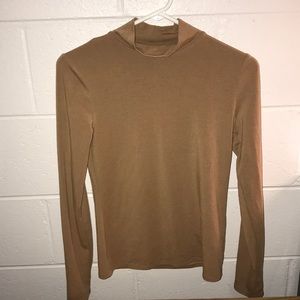 Brown turtleneck.